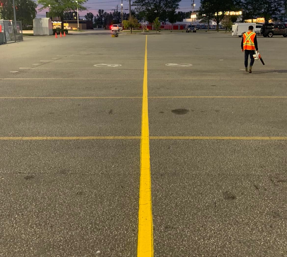 Painting Number Stencils on Parking Lot Pavement
