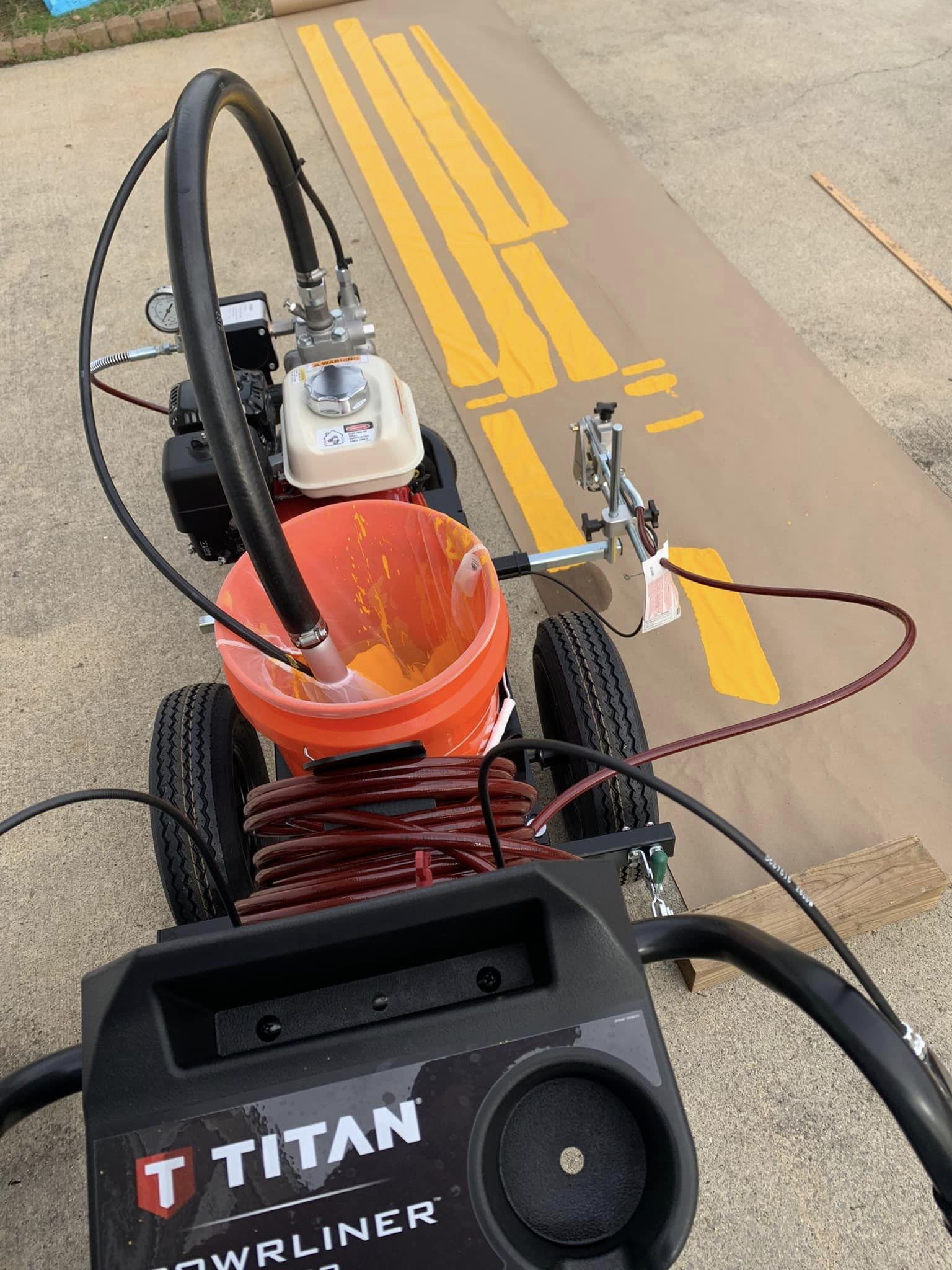 Painting Number Stencils on Parking Lot Pavement