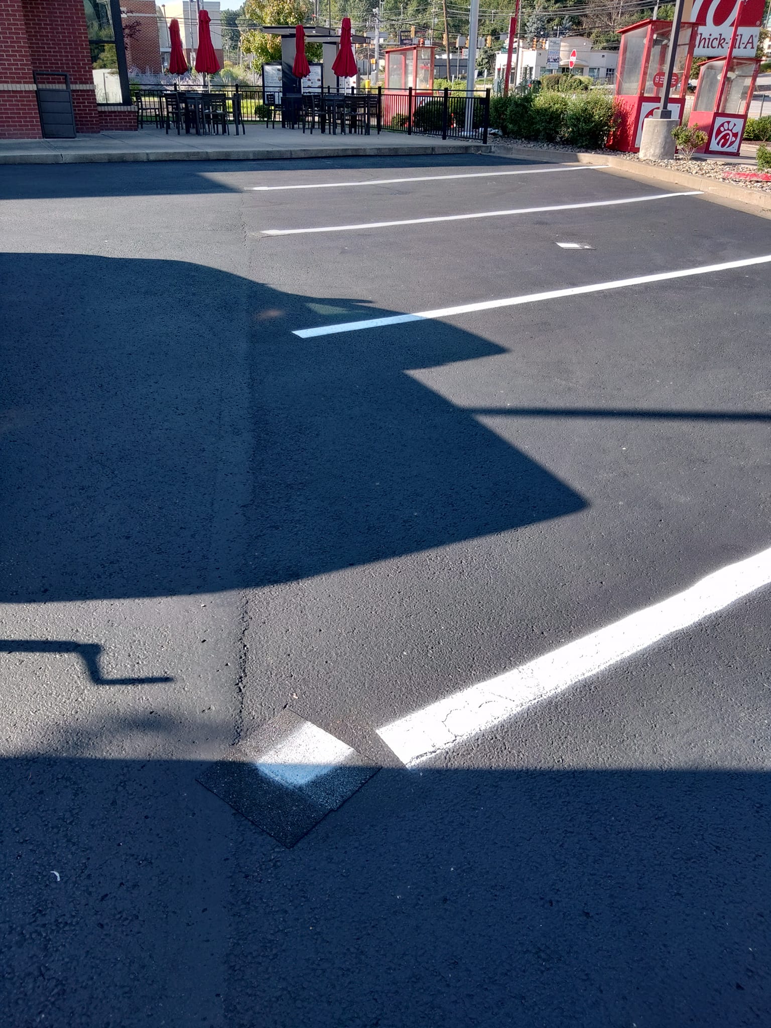 Painting Number Stencils on Parking Lot Pavement