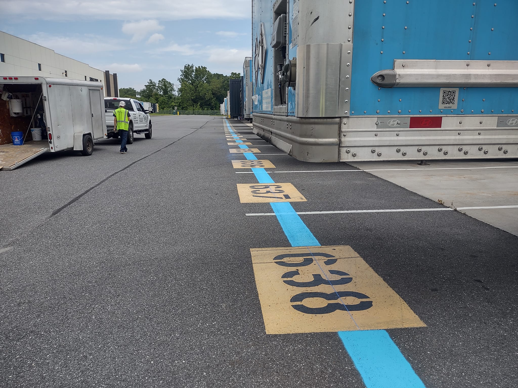 Painting Number Stencils on Parking Lot Pavement